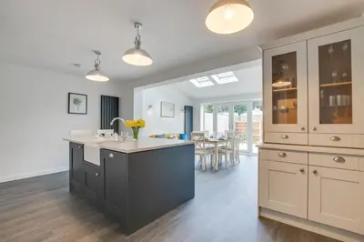 a kitchen with a large island with a sink at 3 Bed in Woodbridge oc-30mor in Woodbridge