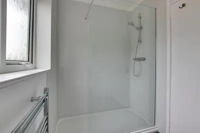 a shower with a glass door in a bathroom at 3 Bed in Woodbridge oc-30mor in Woodbridge