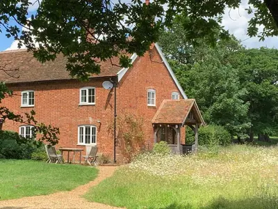 a brick house with a gazebo in front of it at 2 Bed in Iken oc-sfboo in Sudbourne