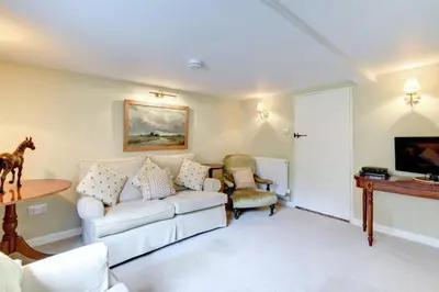 a living room with a white couch and a table at 2 Bed in Iken oc-sfboo in Sudbourne