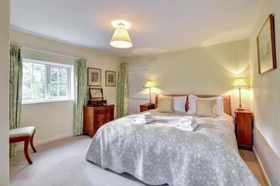 a bedroom with a large bed and a window at 2 Bed in Iken oc-sfboo in Sudbourne