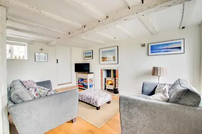 a living room with two couches and a tv at 2 Bed in Snape oc-sfbox in Snape