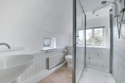 a white bathroom with a sink and a toilet at 4 Bed in Eastbridge oc-bricot in Theberton