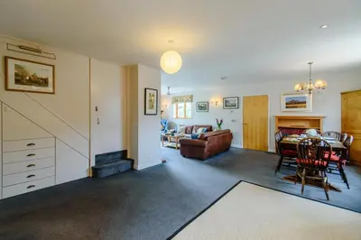 a living room with a table and a couch at 4 Bed in Bramfield oc-sfbri in Bramfield