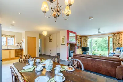 a living room with a table and a couch at 4 Bed in Bramfield oc-sfbri in Bramfield