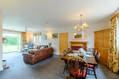 a living room with a couch and a table at 4 Bed in Bramfield oc-sfbri in Bramfield