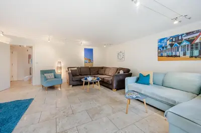 a living room with a couch and a table at 4 Bed in Friston oc-colu in Friston