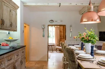 a kitchen with a long table with chairs at 5 Bed in Halesworth oc-cfl in Halesworth
