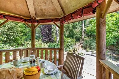 a table with fruit on a wooden porch at 2 Bed in Yoxford oc-c27253 in Wickham Market