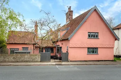 a pink house on the side of a street at 2 Bed in Bramfield oc-cobb in Bramfield