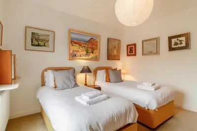 two twin beds in a room with white walls at 4 Bed in Aldeburgh oc-sfcrr in Aldeburgh