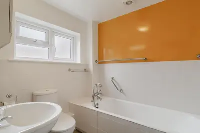 a bathroom with a white toilet and a sink at 4 Bed in Aldeburgh oc-sfcrr in Aldeburgh