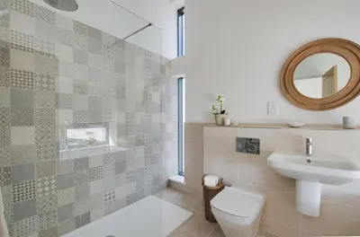 a bathroom with a toilet and a sink and a mirror at 2 Bed in Woodbridge oc-chand in Woodbridge