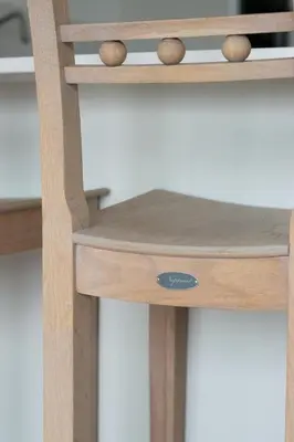 a close up of a wooden stool at 2 Bed in Woodbridge oc-chand in Woodbridge
