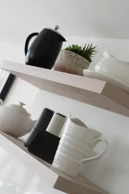 two wooden shelves with plates and cups on them at 2 Bed in Woodbridge oc-chand in Woodbridge