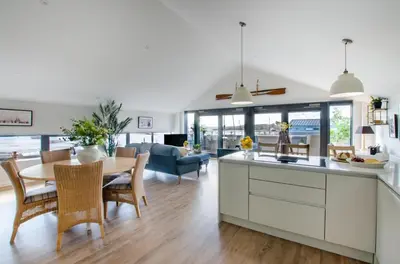 a kitchen and living room with a table and chairs at 2 Bed in Woodbridge oc-chand in Woodbridge
