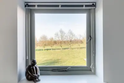a window with a view of a field at 3 Bed in Knodishall oc-ebco in Aldringham