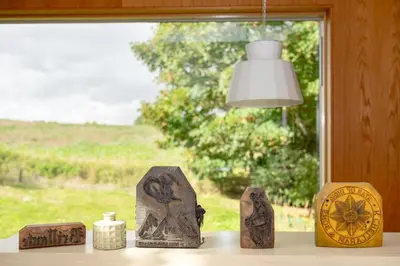 a group of statues sitting on a table in front of a window at 3 Bed in Bramfield oc-hglenv in Bramfield
