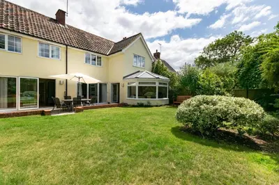 a house with a large yard with a patio and a lawn at 4 Bed in Hacheston oc-hac in Marlesford