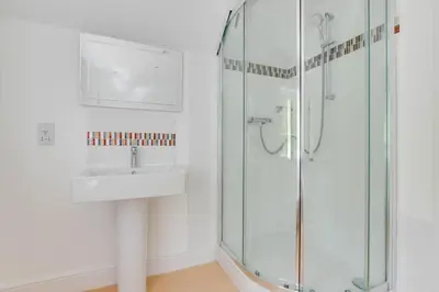 a bathroom with a sink and a shower at 4 Bed in Hacheston oc-hac in Marlesford