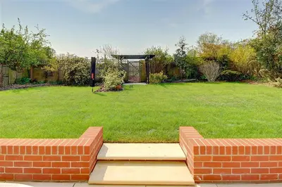 a yard with a brick bench and a grass yard at 4 Bed in Hacheston oc-hac in Marlesford
