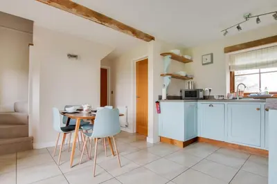 a kitchen and dining room with a table and chairs at 2 Bed in Yoxford oc-hharro in Yoxford
