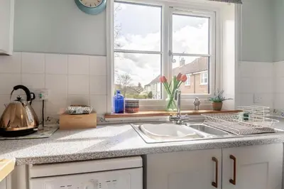 a kitchen counter with a sink and a window at 2 Bed in Halesworth oc-rect in Halesworth
