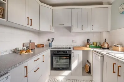 a white kitchen with white cabinets and an oven at 2 Bed in Halesworth oc-rect in Halesworth