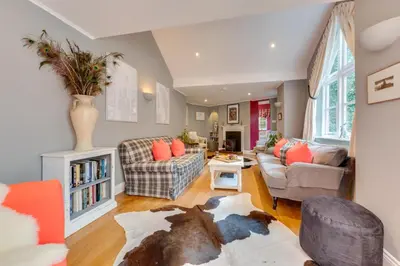 a living room with a couch and chairs at 2 Bed in Tunstall oc-ivylod in Rendlesham