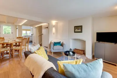 a living room with a couch and a dining room at 1 Bed in Wenhaston oc-jap in Wenhaston