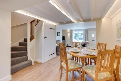 a dining room with a table and chairs at 1 Bed in Wenhaston oc-jap in Wenhaston