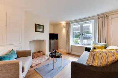 a living room with a couch and a table at 1 Bed in Wenhaston oc-jap in Wenhaston
