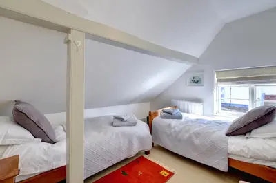 a bedroom with two beds and a window at 2 Bed in Orford oc-sflis in Orford