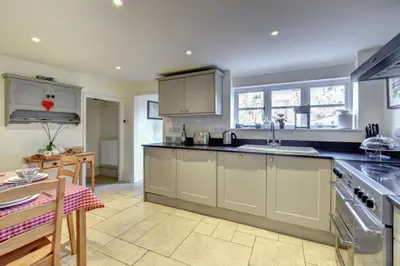 a kitchen with a sink and a counter top at 2 Bed in Orford oc-sflis in Orford