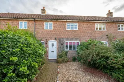 a red brick house with a white door at 2 Bed in Friston oc-lcq in Friston