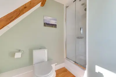a bathroom with a toilet and a glass shower at 4 Bed in Halesworth oc-mdh in Blythburgh