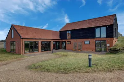a brick house with a brown roof at 4 Bed in Halesworth oc-mdh in Blythburgh