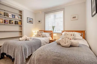 a bedroom with two beds and a window at 7 Bed in Aldeburgh oc-midba in Aldeburgh