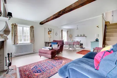 a living room with a blue couch and chairs at 2 Bed in Ufford oc-sfmcu in Ufford