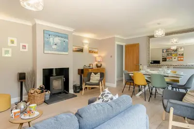 a living room with a blue couch and a table at 3 Bed in Westleton oc-egv in Westleton