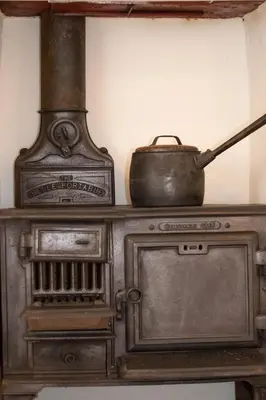 an old stove with a pot on top of it at 2 Bed in Saxtead oc-pera in Saxtead