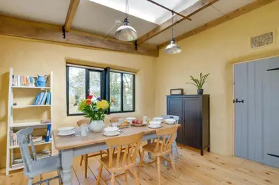 a dining room with a wooden table and chairs at 2 Bed in Haughley oc-strb in Haughley