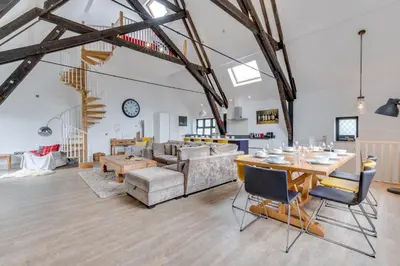 a living room with a table and a couch at 4 Bed in Thorpeness oc-cho in Thorpeness