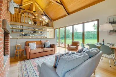a living room with a couch and a table at 3 Bed in Debenham oc-thefol in Debenham
