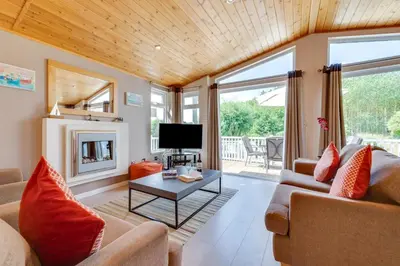 a living room with a couch and a table at 2 Bed in Aldeburgh oc-har in Aldeburgh