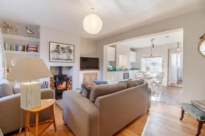 a living room with a couch and a table at 2 Bed in Orford oc-sflpo in Orford