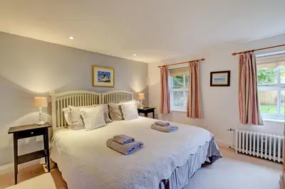 a bedroom with a bed with two towels on it at 2 Bed in Snape oc-sfoms in Snape