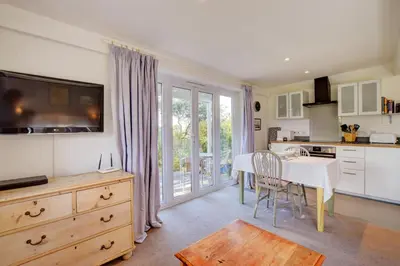 a kitchen with a table and a dining room at 2 Bed in Snape oc-sfoms in Snape