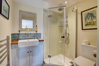 a bathroom with a sink and a shower at 2 Bed in Snape oc-sfoms in Snape