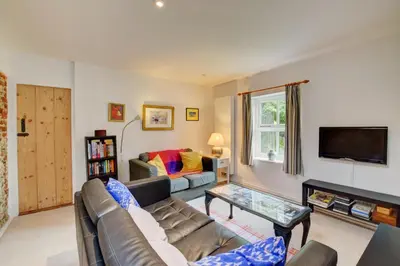 a living room with a couch and a tv at 2 Bed in Snape oc-sfoms in Snape